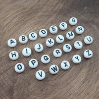 1 Black and white flat round letter bead