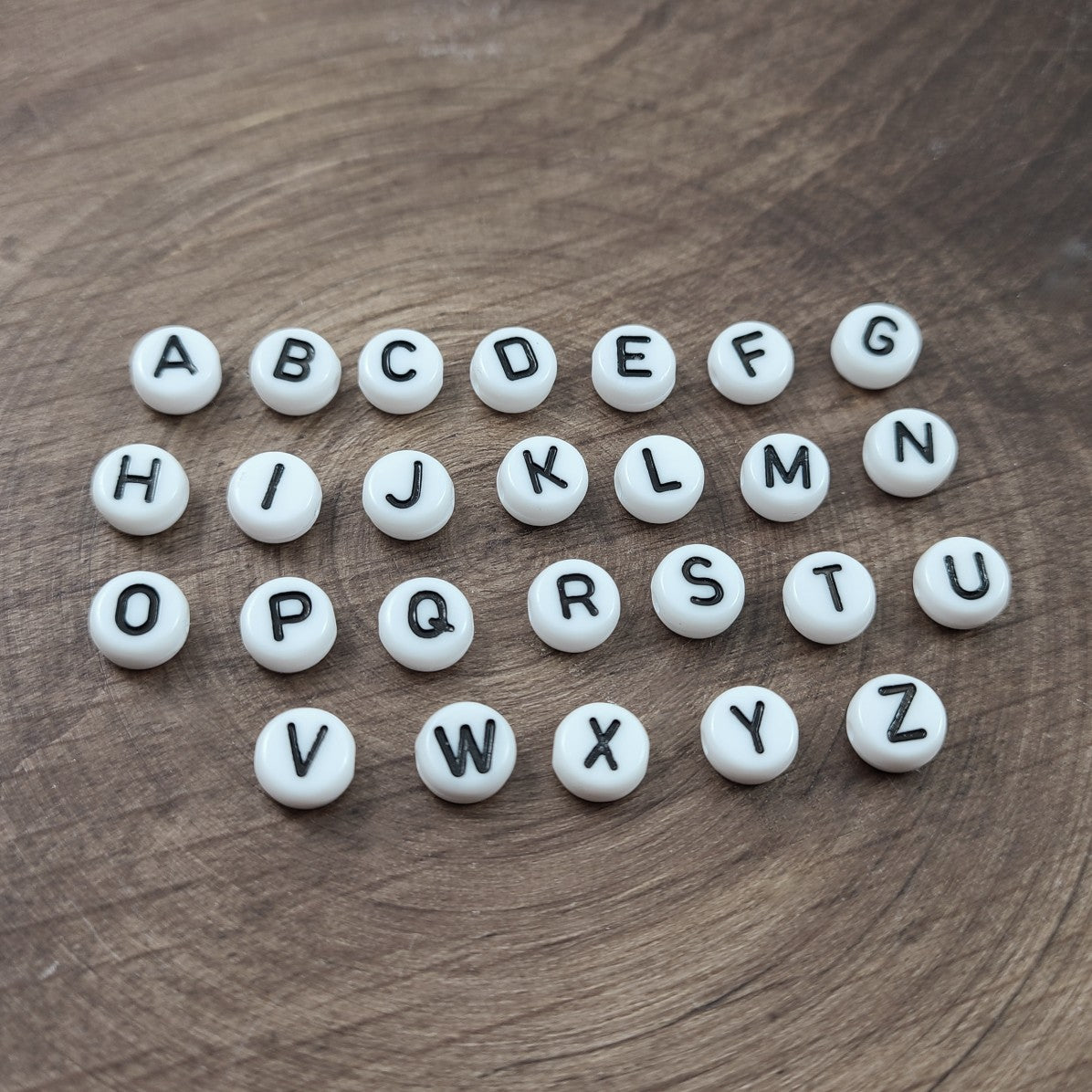 1 Black and white flat round letter bead